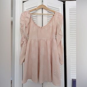 Shirt pink dress with long sleeve.